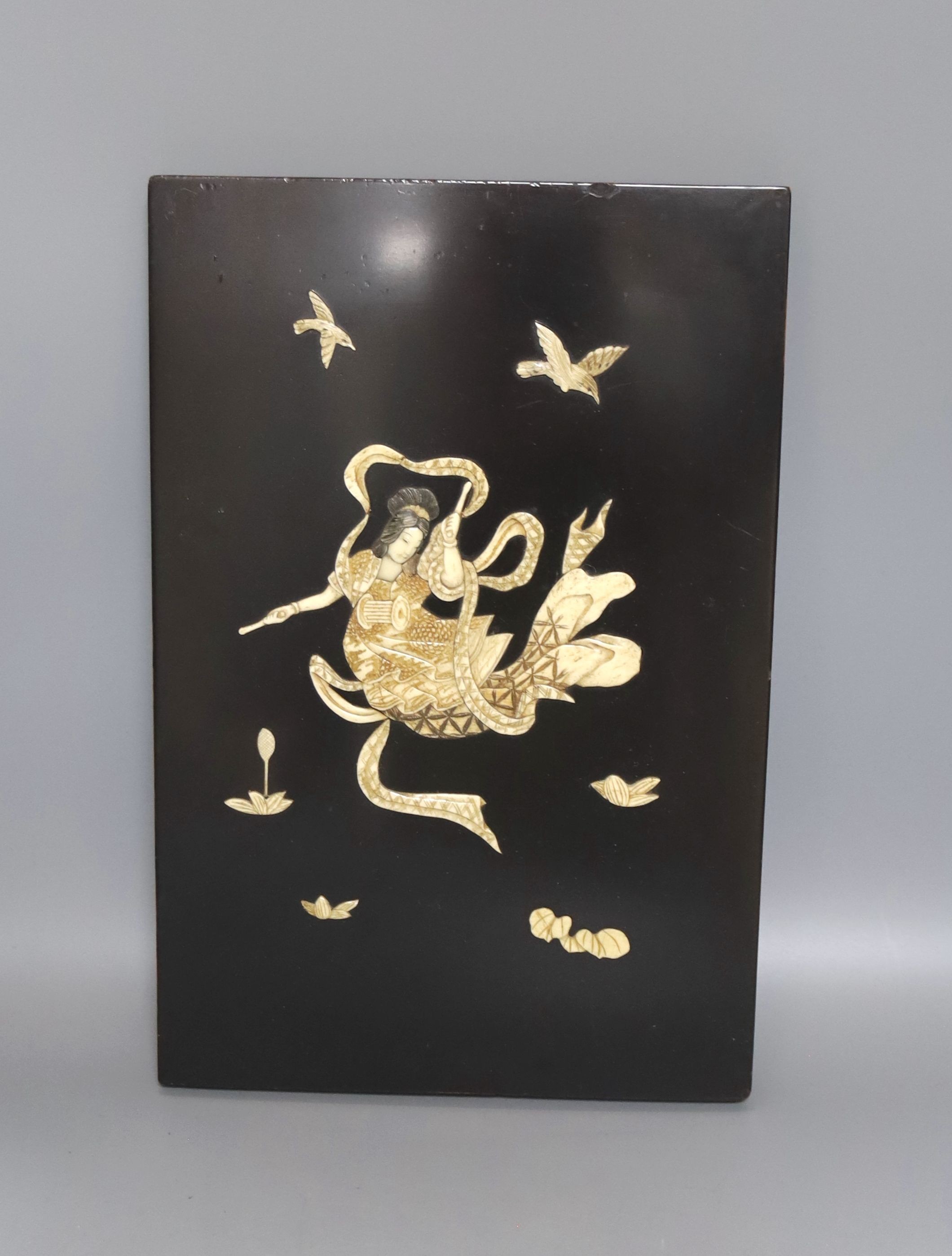 A Japanese ivory and bone inlaid lacquer panel of an immortal, late 19th century, 30x20cm